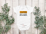 CAUTION May cause drowsiness bodysuit or tee