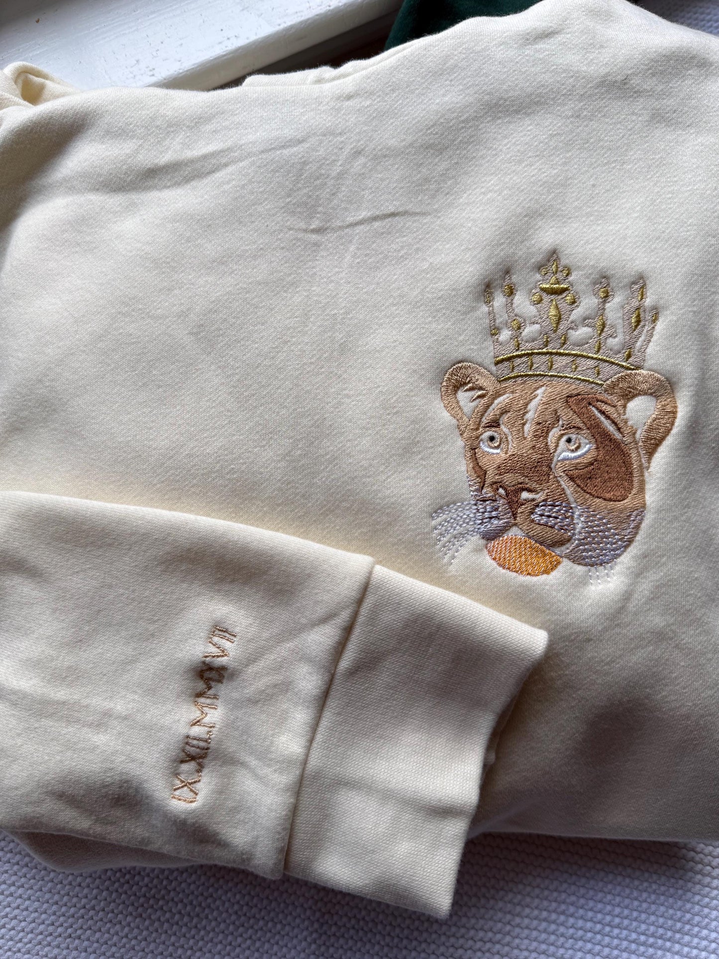 Lion/Lioness Sher/Sherni Embroidered Sweatshirt w roman numeral sleeve
