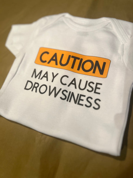 CAUTION May cause drowsiness bodysuit or tee